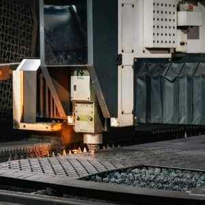 Industrial laser cutter working on metal sheet